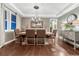 Formal dining room with stylish chandelier, dark hardwood flooring and buffet at 5478 Water Oak Cir, Castle Rock, CO 80108