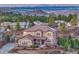 Beautiful two-story home with landscaped yard and stunning mountain views in the background at 5478 Water Oak Cir, Castle Rock, CO 80108