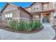 Inviting front entrance with a well-maintained landscape and walkway at 5478 Water Oak Cir, Castle Rock, CO 80108