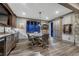 Charming game room features a wet bar, rustic finishes, dart board and direct access to the outdoors at 5478 Water Oak Cir, Castle Rock, CO 80108