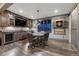 Charming game room features a wet bar, rustic finishes, dart board and direct access to the outdoors at 5478 Water Oak Cir, Castle Rock, CO 80108