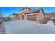 Spacious three-car garage with ample parking space on a concrete driveway at 5478 Water Oak Cir, Castle Rock, CO 80108