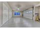 Bright garage with storage cabinets and epoxy flooring at 5478 Water Oak Cir, Castle Rock, CO 80108