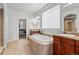 Luxurious bathroom with soaking tub and double vanity at 9217 E 4Th Pl, Denver, CO 80230