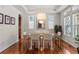 Elegant dining room with hardwood floors and large windows at 9217 E 4Th Pl, Denver, CO 80230