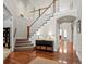 Bright and spacious entryway with hardwood floors and staircase at 9217 E 4Th Pl, Denver, CO 80230