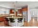 Spacious kitchen with granite island and stainless steel appliances at 9217 E 4Th Pl, Denver, CO 80230