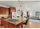 Gourmet kitchen features a large island with gas cooktop at 9217 E 4Th Pl, Denver, CO 80230