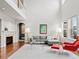 Bright living room with high ceilings and hardwood floors at 9217 E 4Th Pl, Denver, CO 80230