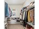 Large walk-in closet with ample shelving and hanging space at 9217 E 4Th Pl, Denver, CO 80230