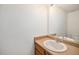 Clean half-bathroom featuring a modern sink and vanity, perfect for guests at 2141 Coronado N Pkwy # C, Denver, CO 80229