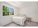 Comfortable bedroom with a large window and cozy decor, creating a relaxing ambiance at 2141 Coronado N Pkwy # C, Denver, CO 80229
