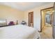 Bedroom shows an ensuite bathroom and neutral walls at 1868 S Ammons St # D, Lakewood, CO 80232