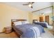 Spacious bedroom with large mirrored closet and ceiling fan at 1868 S Ammons St # D, Lakewood, CO 80232