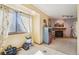 Bright dining area with a large window and access to the living room at 1868 S Ammons St # D, Lakewood, CO 80232