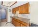 Kitchen features tiled floors, granite counters, and stainless steel dishwasher at 1868 S Ammons St # D, Lakewood, CO 80232