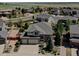 An aerial view of the home and property showing the mature landscaping and proximity to neighbors at 973 Orion Way, Castle Rock, CO 80108
