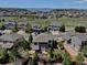 A high aerial view showcases the property's location and layout in the community with mountain views in the distance at 973 Orion Way, Castle Rock, CO 80108