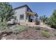Beautifully landscaped backyard featuring a well-maintained garden and a covered patio area at 973 Orion Way, Castle Rock, CO 80108