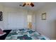 Cozy bedroom features a ceiling fan, a closet, and an open doorway to the upstairs landing at 973 Orion Way, Castle Rock, CO 80108
