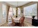 Cozy breakfast nook featuring bright windows and a sliding glass door to the outdoor patio area at 973 Orion Way, Castle Rock, CO 80108