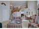 Open-concept living room with a staircase, dining area, and view of the second-floor balcony at 973 Orion Way, Castle Rock, CO 80108
