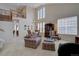 Bright and airy living room with high ceilings, large windows, and a view of the second-floor balcony at 973 Orion Way, Castle Rock, CO 80108
