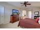 Spacious primary bedroom with ensuite bath, large dresser and comfortable bed at 973 Orion Way, Castle Rock, CO 80108