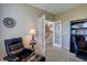 Inviting home office with French doors leading to the staircase, complemented by a cozy reading chair at 973 Orion Way, Castle Rock, CO 80108