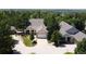 An aerial view of a home showcasing its well-manicured lawn, mature trees, and proximity to the golf course at 10619 N Osceola Dr, Westminster, CO 80031