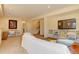 Open basement area with carpet, comfortable seating, built-in shelving, and a TV at 10619 N Osceola Dr, Westminster, CO 80031