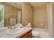 Well-lit bathroom with tiled walls, single sink vanity and a shower/tub combo at 10619 N Osceola Dr, Westminster, CO 80031