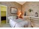 Inviting bedroom featuring floral wallpaper, a cozy bed, and ample natural light at 10619 N Osceola Dr, Westminster, CO 80031