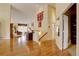 Warm, inviting entryway showcases gleaming hardwood floors that flow into an open floor plan with vaulted ceilings at 10619 N Osceola Dr, Westminster, CO 80031