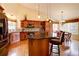 Gourmet kitchen featuring custom cabinetry, a granite island, and modern stainless steel appliances under pendant lighting at 10619 N Osceola Dr, Westminster, CO 80031