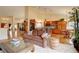 An open concept living space connects a kitchen and dining area, with a cozy seating area and decorative accents at 10619 N Osceola Dr, Westminster, CO 80031