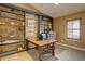 Charming office with custom built-in bookshelves, a wooden desk, and a comfortable chair at 10619 N Osceola Dr, Westminster, CO 80031