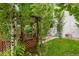 Backyard featuring a wooden gazebo surrounded by mature trees and lush greenery at 3613 Julian St, Denver, CO 80211