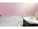 Bright bathroom with a vanity and tile detail on the walls at 3613 Julian St, Denver, CO 80211