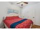 Bright bedroom features a ceiling fan, two closets, and hardwood floors at 3613 Julian St, Denver, CO 80211