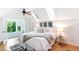 Bright bedroom featuring skylights, neutral decor, and a view to the lush backyard through double French doors at 3613 Julian St, Denver, CO 80211