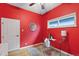 Vibrant bedroom features light hardwood floors, a ceiling fan, and a window at 3613 Julian St, Denver, CO 80211