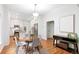 Bright dining room with modern table and chairs, with an open flow into the kitchen at 3613 Julian St, Denver, CO 80211