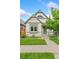 Charming single-Gathering home with a well-manicured lawn, sidewalk and decorative exterior trim at 3613 Julian St, Denver, CO 80211