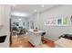 Open kitchen with island and hardwood floors leading into the living and dining room area at 3613 Julian St, Denver, CO 80211