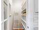 Pantry area with ladder features built-in shelving at 3613 Julian St, Denver, CO 80211