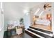 Open space featuring a small sitting area with an attached bedroom, light walls, and wood floors at 3613 Julian St, Denver, CO 80211