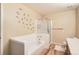 This bathroom features a soaking tub and glass-enclosed shower at 10507 W Maplewood Dr # E, Littleton, CO 80127