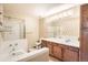 This bright bathroom features a shower and a soaking tub at 10507 W Maplewood Dr # E, Littleton, CO 80127