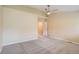 This bedroom is spacious and features updated carpet and a ceiling fan at 10507 W Maplewood Dr # E, Littleton, CO 80127